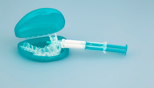 Teal plastic take-home teeth whitening supplies