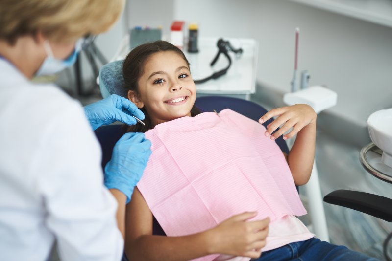 Child smiling at the dentist.