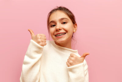 Kid smiling with braces.